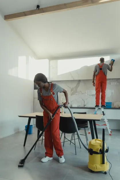 Commercial kitchen worker maintaining hood filter equipment